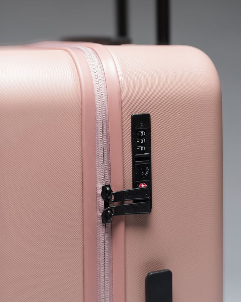 An assortment of Herschel Heritage Hardshell Carry On Luggage available in various colors.