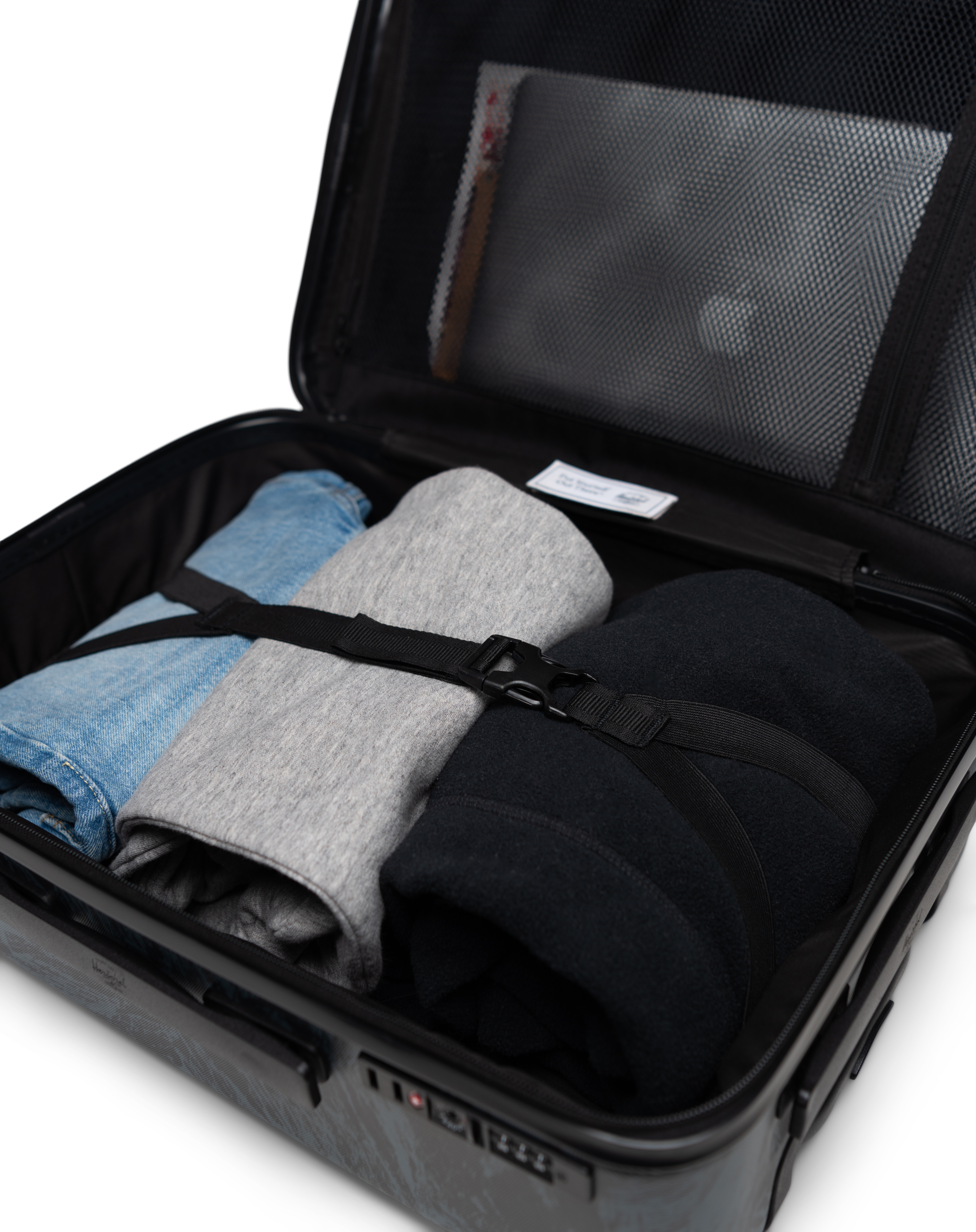 Size chart for Herschel Heritage Hardshell Luggage showing dimensions and volumes for Carry On (35L), Large Carry On (43L), Medium (67L), and Large (95L) sizes.