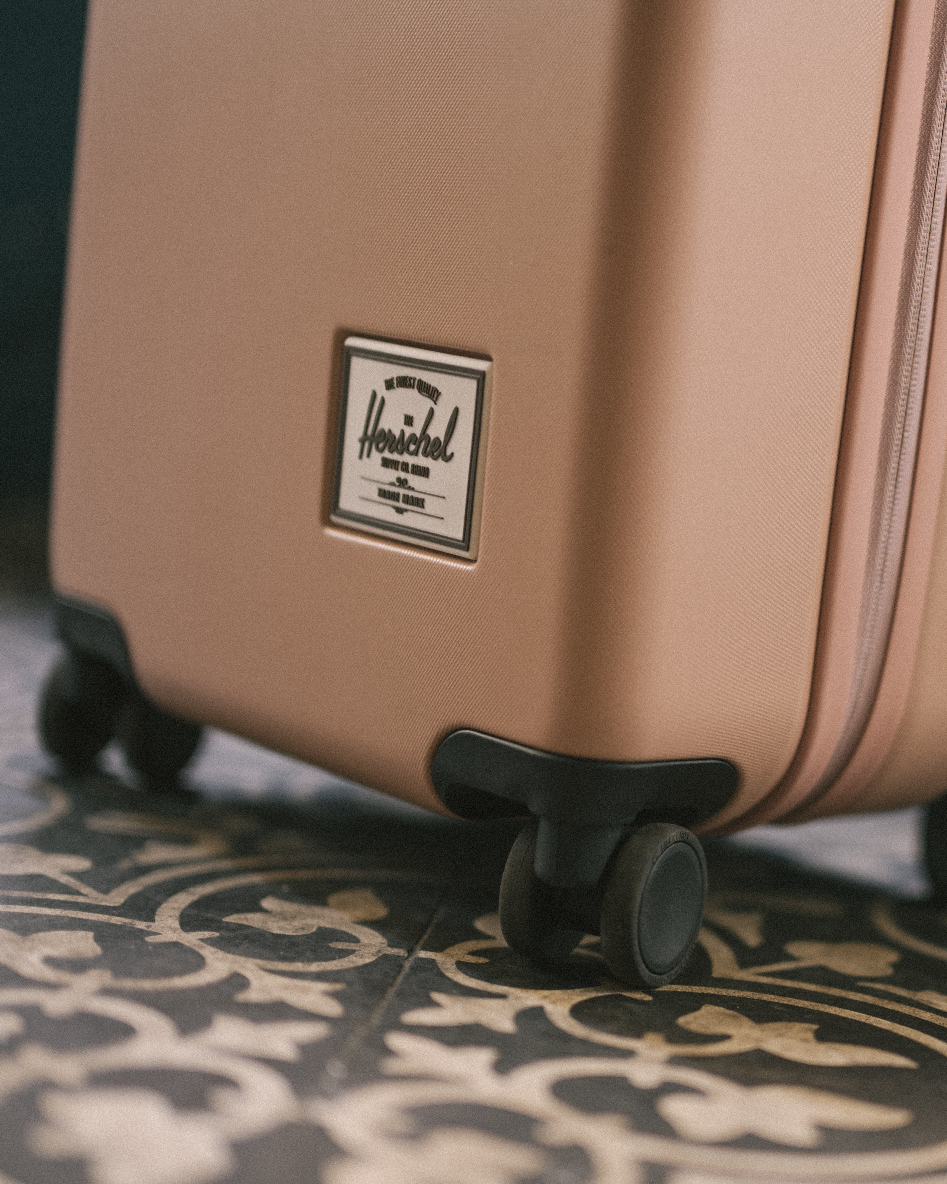 Herschel Supply Co. Heritage Hardshell Medium Luggage, featuring an impact-resistant recycled polycarbonate shell with reinforced corners.