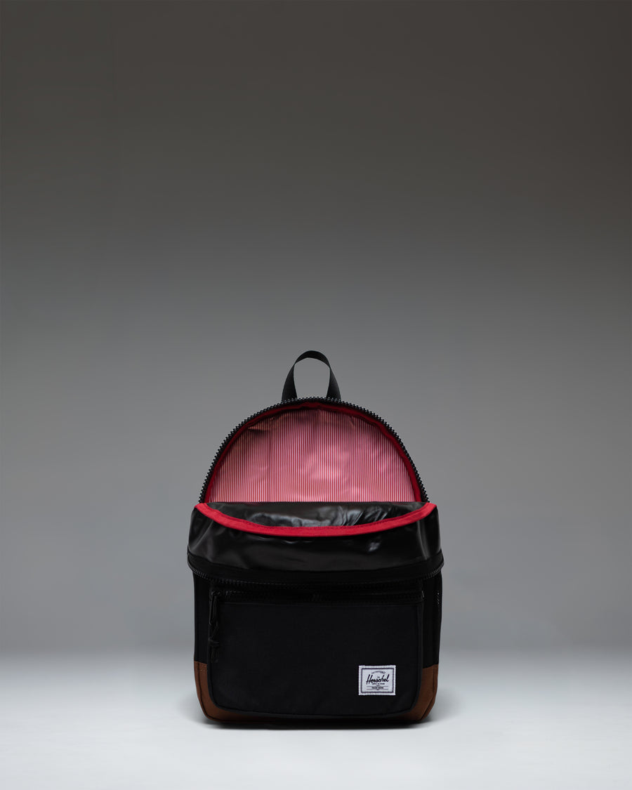 Herschel Heritage Kids Backpack in Black/Saddle Brown featuring a front pocket and signature diamond detail.