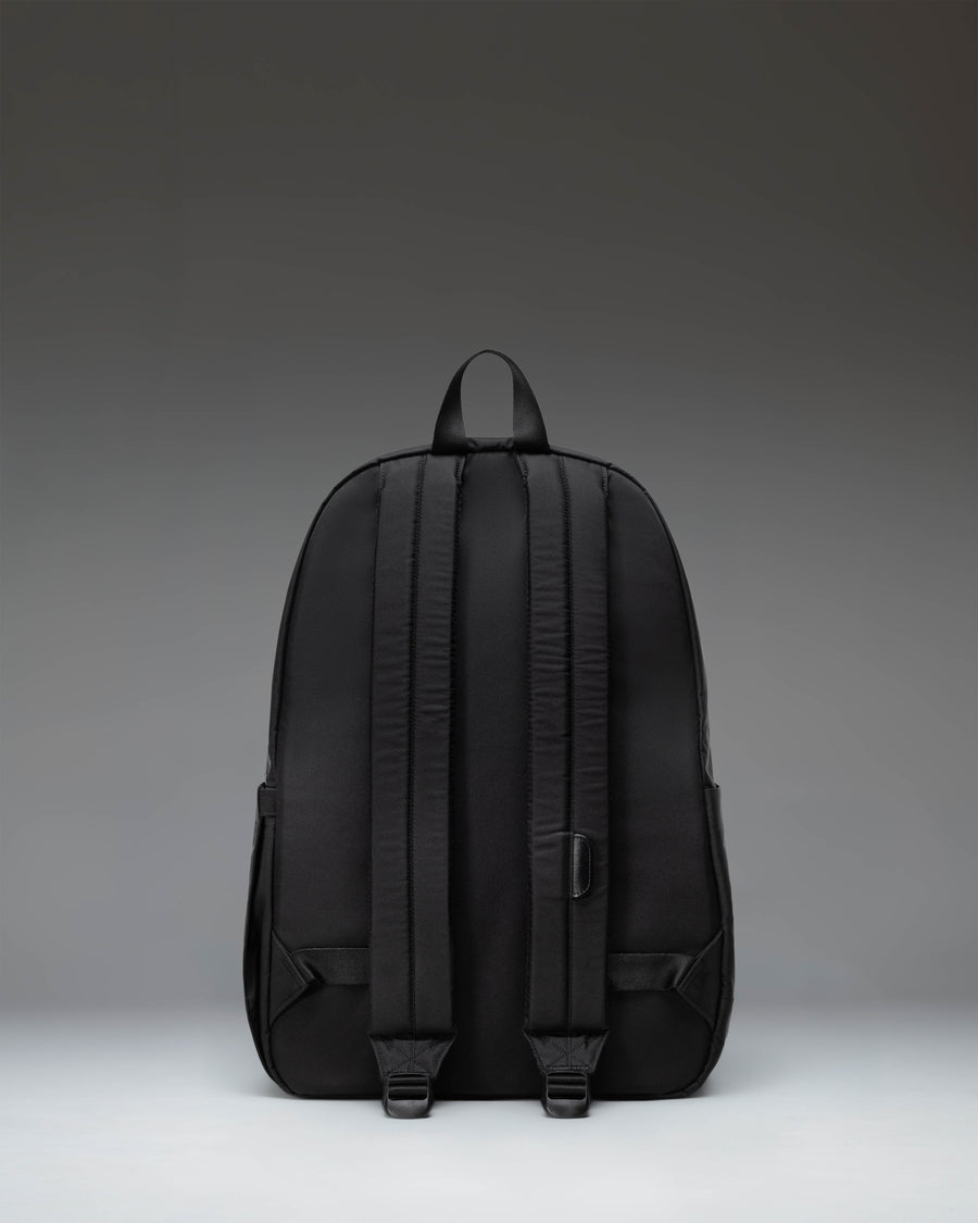 Black Herschel Heritage Backpack showing its classic design with a front pocket and signature diamond detail.