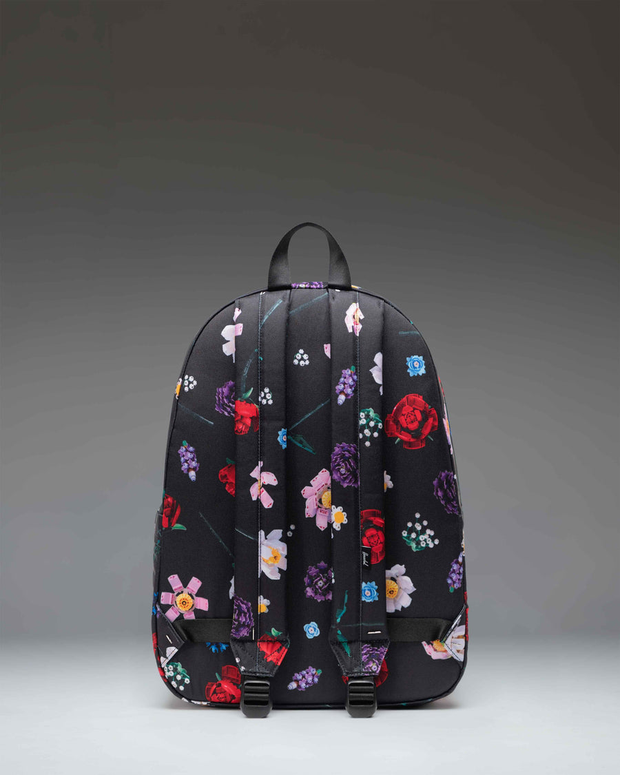 LEGO Herschel Classic XL Backpack in Falling Florals print featuring LEGO brick themed accents.