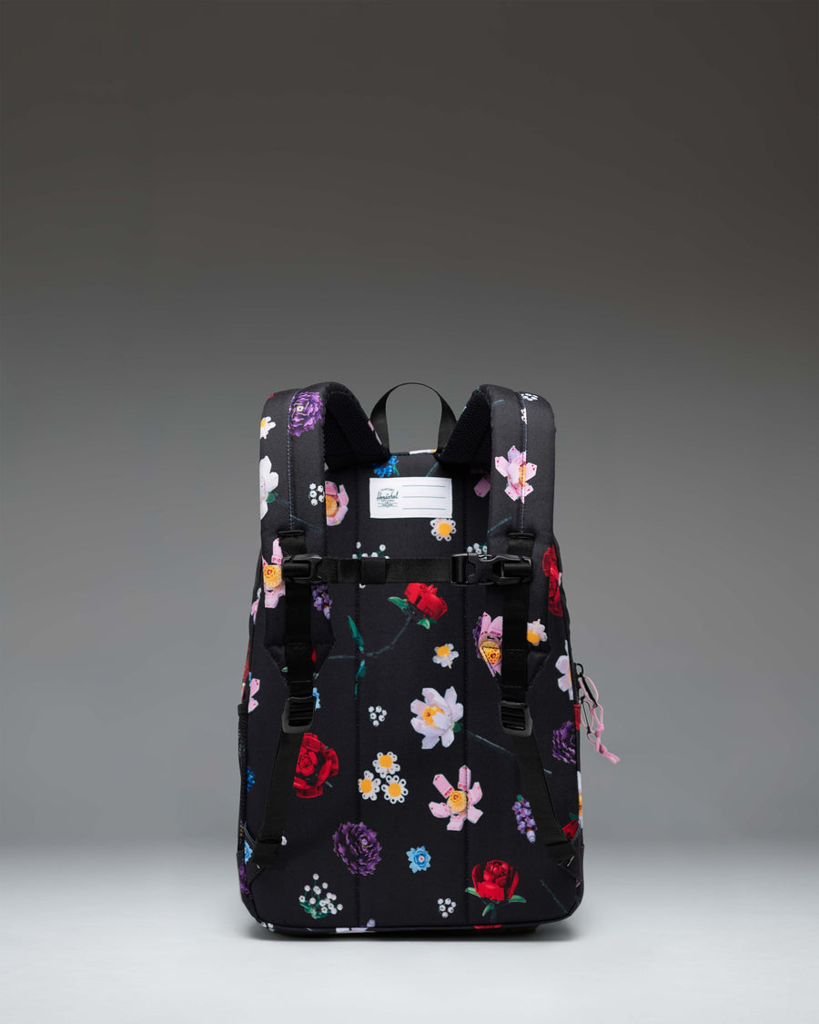 LEGO Herschel Heritage Youth Backpack featuring a colorful Falling Florals pattern with LEGO brick details.