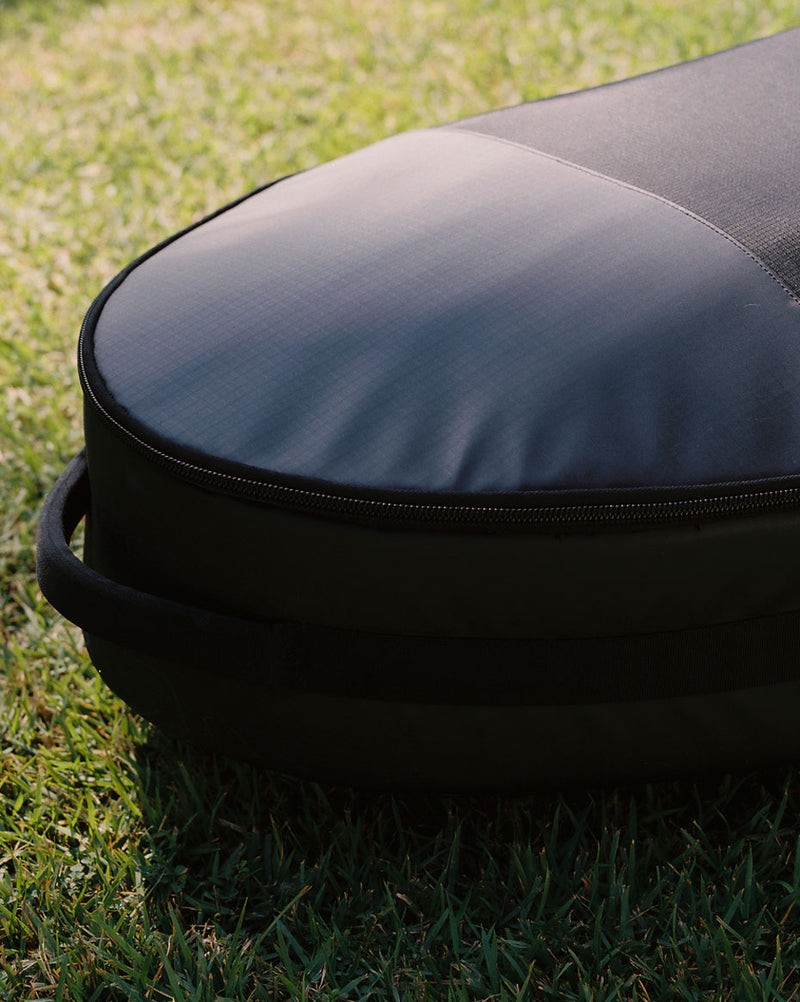 Black Herschel Surfboard Travel Bag Hybrid 7 Ft, designed to fit two hybrid surfboards for travel.