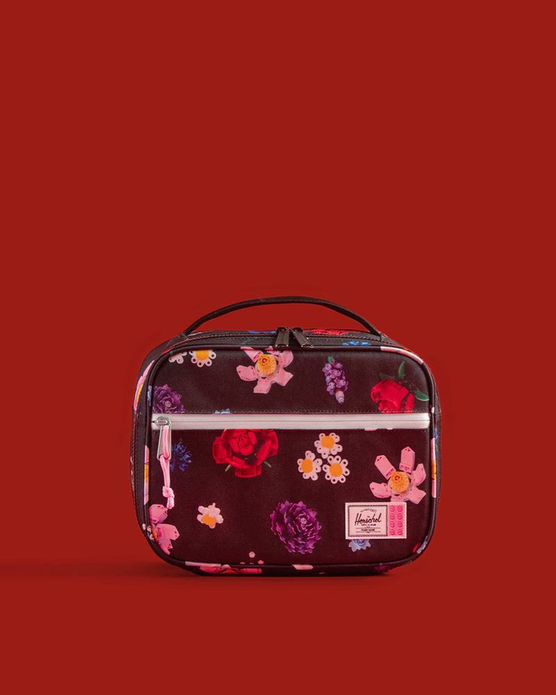 Herschel Supply Co. LEGO Pop Quiz Lunch Box in Falling Florals featuring a colorful floral print.