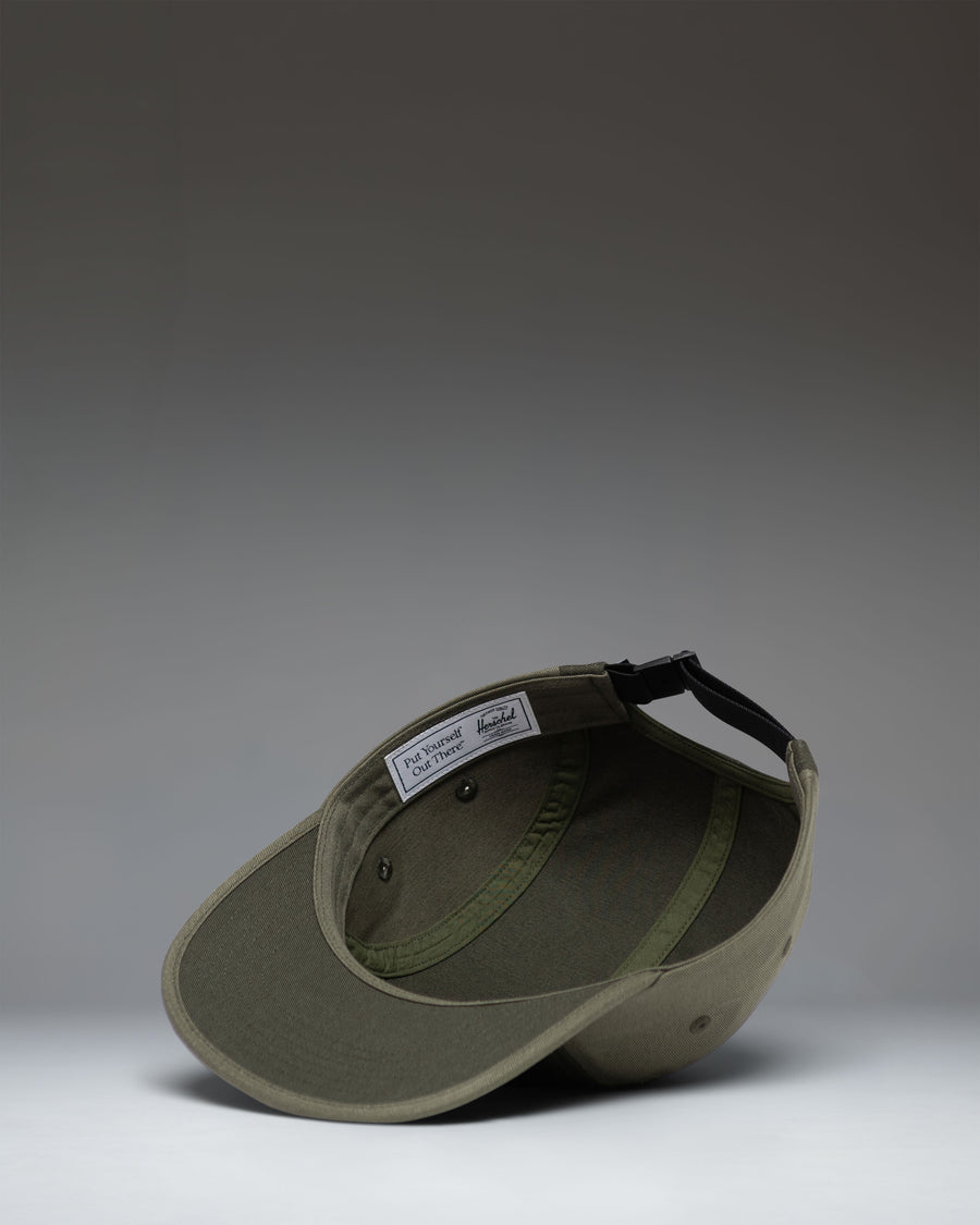 Herschel Supply Co Glendale Cap in Deep Depths and Dusty Olive, showing the adjustable strap on the back.