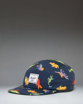 Herschel Supply Co. Glendale Kids Cap in Water Colour Dinosaurs Darkest Navy, featuring a colorful dinosaur pattern on a dark navy background.