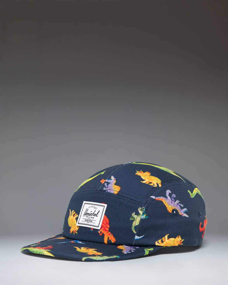 Herschel Supply Co. Glendale Kids Cap in Water Colour Dinosaurs Darkest Navy, featuring a colorful dinosaur pattern on a dark navy background.