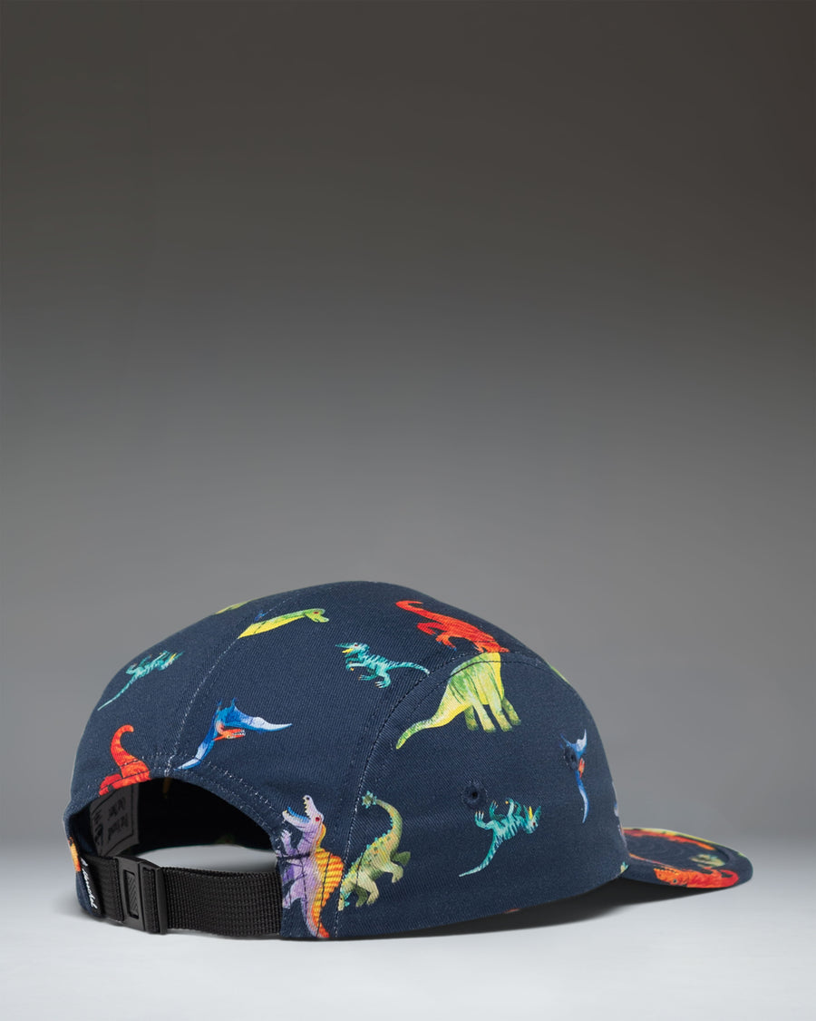 Herschel Supply Co. Glendale Kids Cap in Water Colour Dinosaurs Darkest Navy, featuring a colorful dinosaur pattern on a dark navy background.