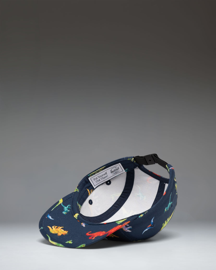 Herschel Supply Co. Glendale Kids Cap in Water Colour Dinosaurs Darkest Navy.