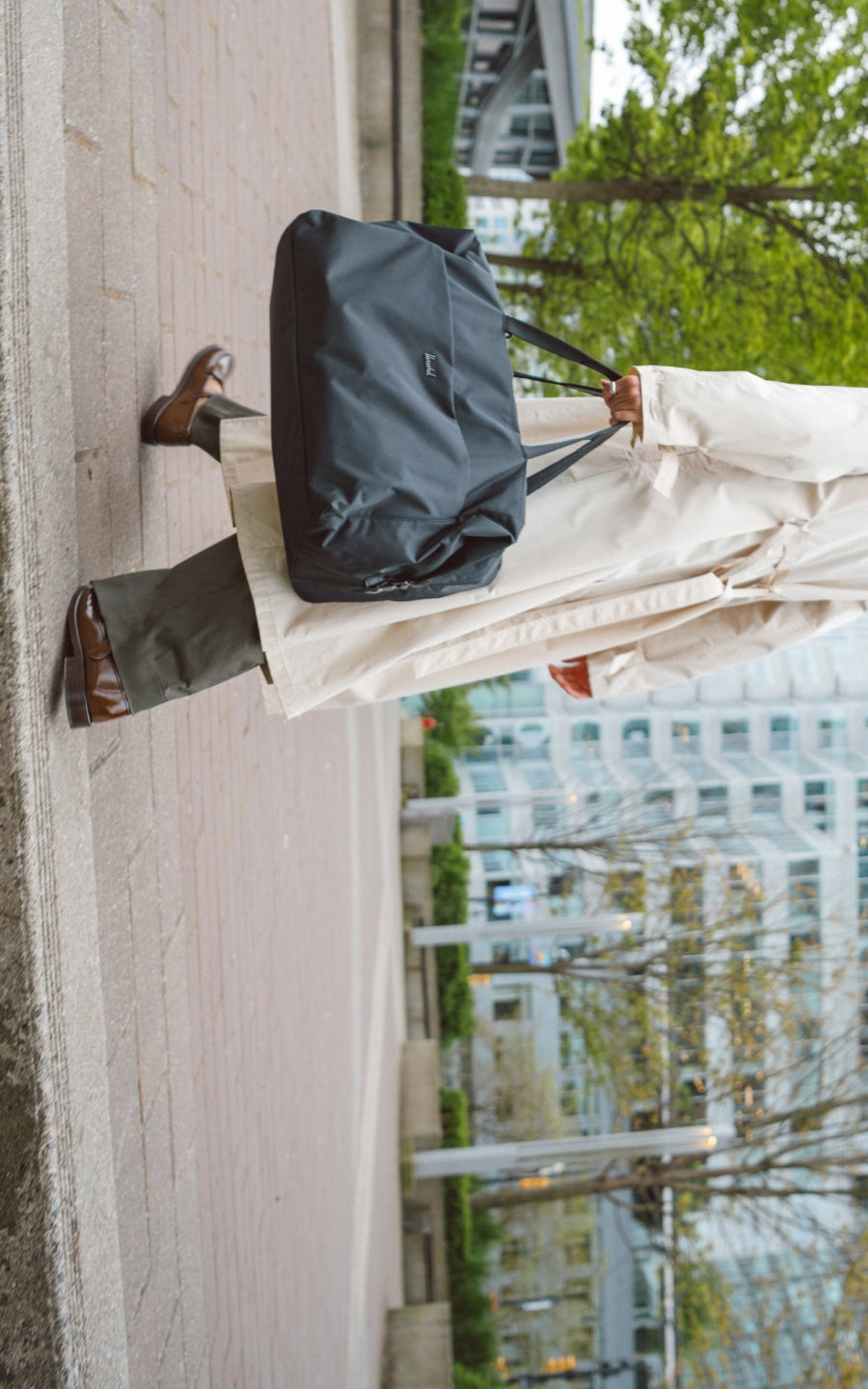 Herschel Supply Co. Maia Weekender bag in solid black, featuring dual top carry handles and a clean, minimalist design for travel or daily use.