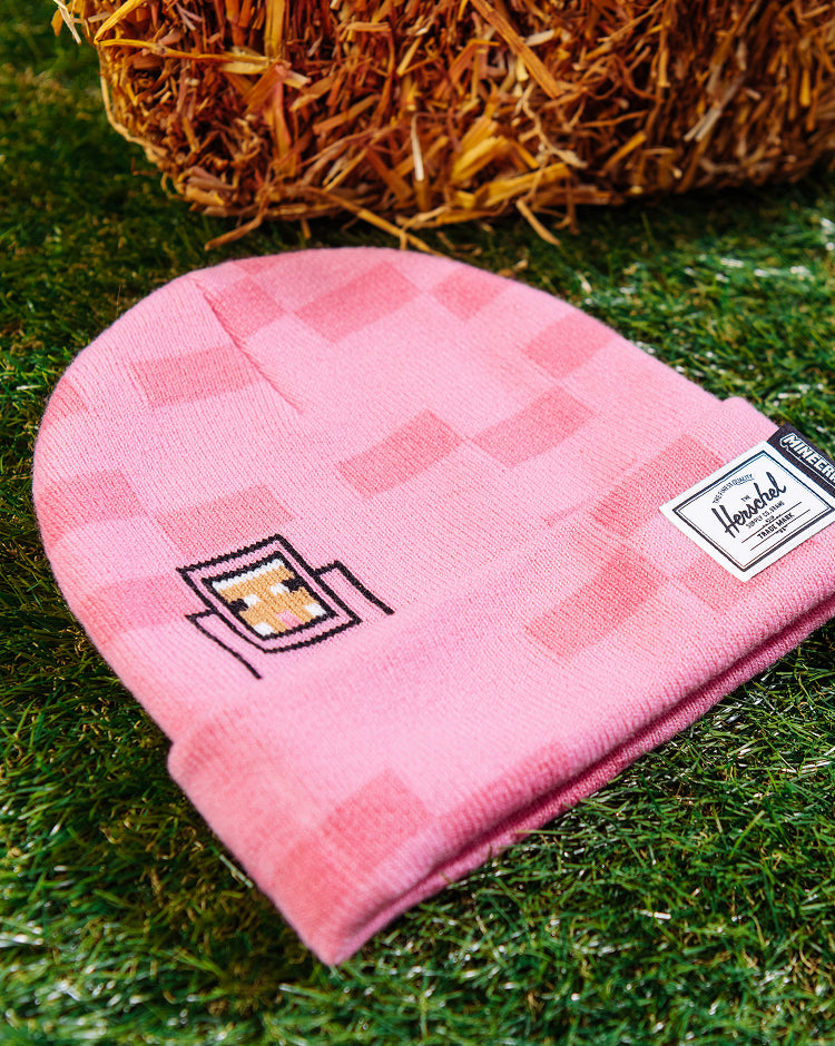 Herschel Supply Co. Minecraft Elmer Kids Beanie in Pink Sheep, a light pink knit beanie featuring a Minecraft character patch on the cuff.