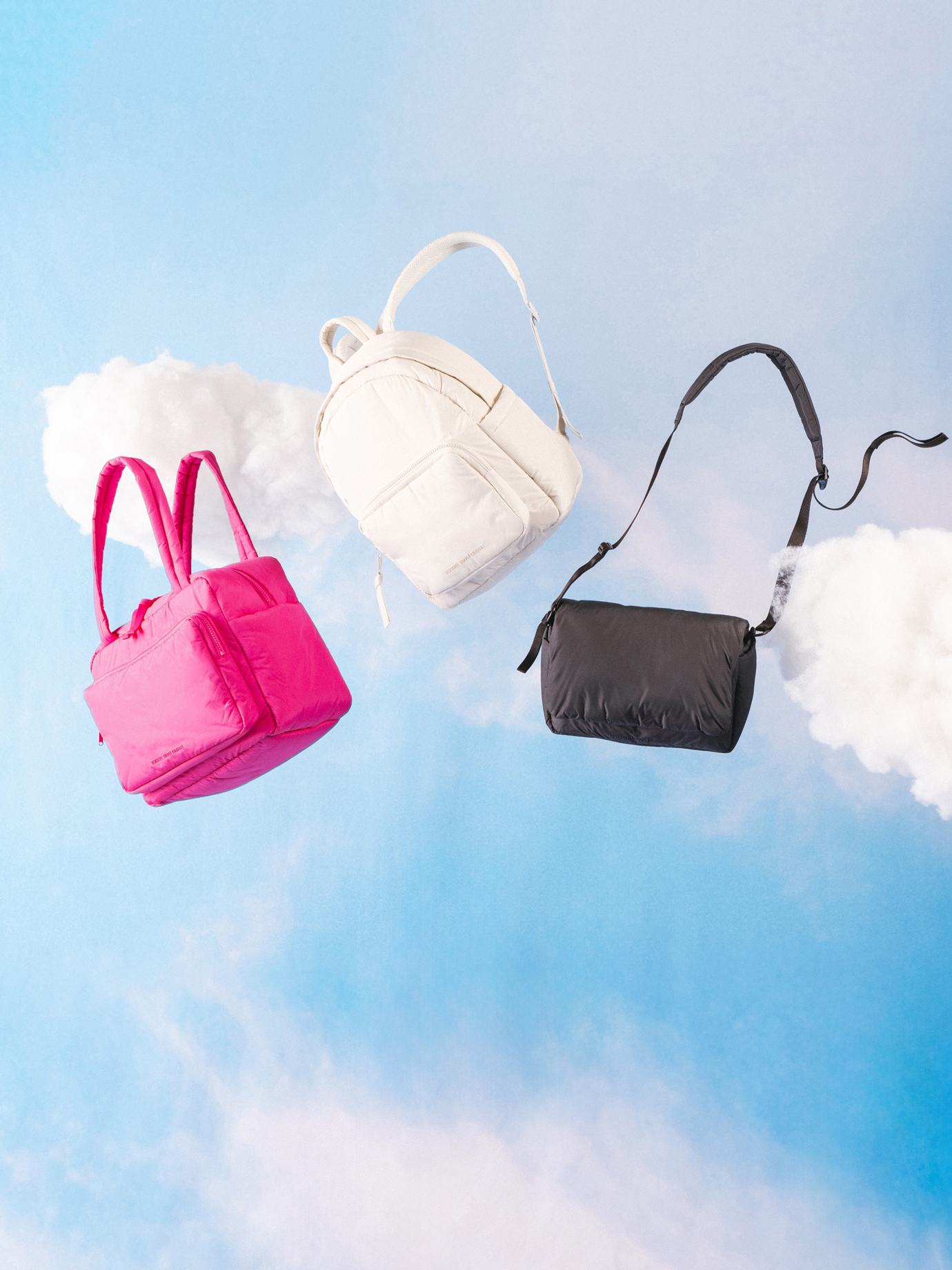 Herschel Supply Co. Cloudform collection essential bags, apparel, and accessories arranged together on a flat surface.